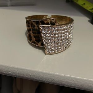 Adorable bracelet with a hinge open to fit just about any size wrist!